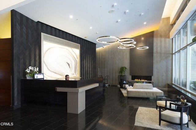 1155 S Grand Ave Unit 1403, Los Angeles, CA 90015 - reception area featuring wallpapered walls and a large fireplace