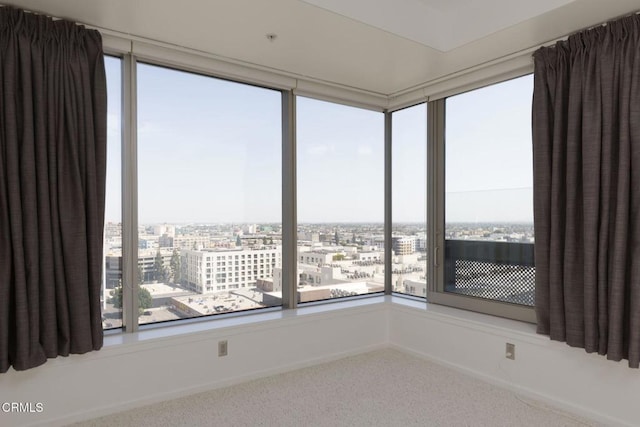 1155 S Grand Ave Unit 1403, Los Angeles, CA 90015 - carpeted spare room featuring plenty of natural light and a city view