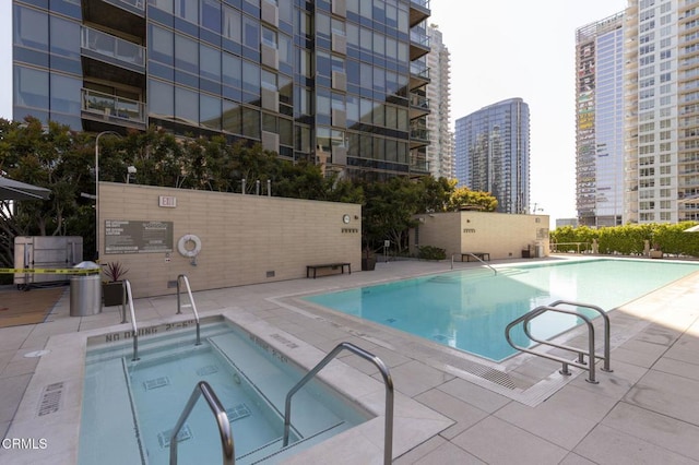 1155 S Grand Ave Unit 1403, Los Angeles, CA 90015 - community pool featuring a view of city and a patio