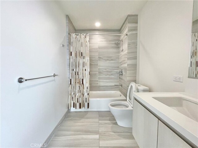 1050 S Grand Ave Unit 2003, Los Angeles, CA 90015 - bathroom featuring toilet, vanity, shower / bathtub combination with curtain, and marble look tile flooring