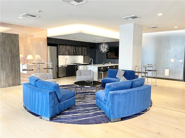 1050 S Grand Ave Unit 2003, Los Angeles, CA 90015 - living room featuring light wood-style flooring