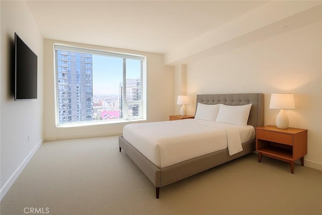 1050 S Grand Ave Unit 2003, Los Angeles, CA 90015 - carpeted bedroom featuring baseboards