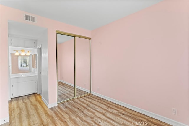 68 Via Terrano, Rancho Santa Margarita, CA 92688 - unfurnished bedroom with wood finished floors, baseboards, and a closet