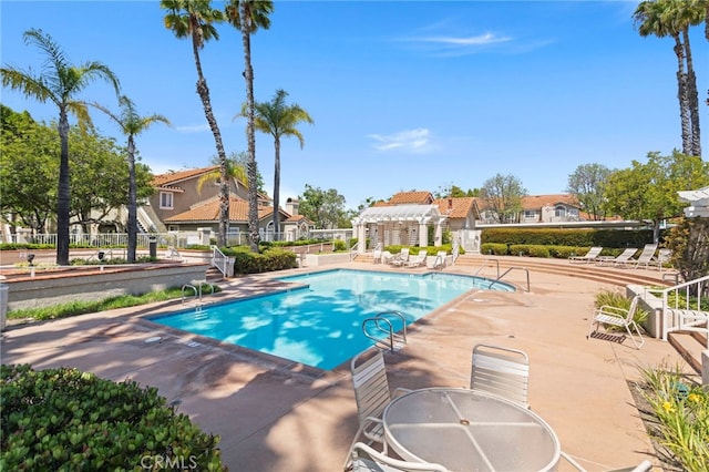 68 Via Terrano, Rancho Santa Margarita, CA 92688 - community pool with a pergola, a patio area, and a residential view