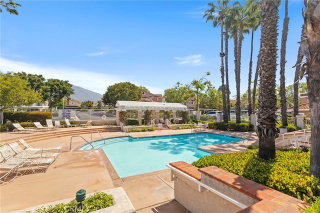 68 Via Terrano, Rancho Santa Margarita, CA 92688 - community pool with a patio area and a mountain view