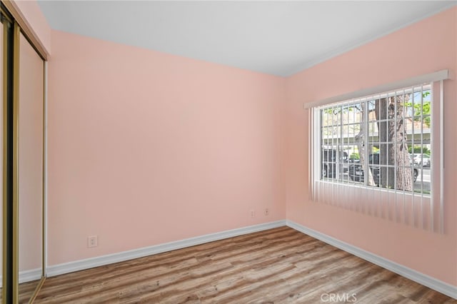 68 Via Terrano, Rancho Santa Margarita, CA 92688 - unfurnished bedroom with baseboards, wood finished floors, and a closet