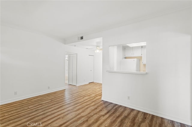 68 Via Terrano, Rancho Santa Margarita, CA 92688 - empty room with wood finished floors, baseboards, ornamental molding, and ceiling fan