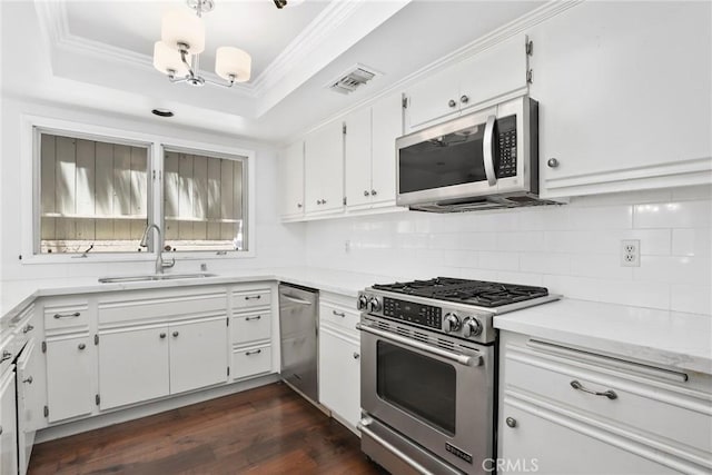 749 Canyon Crest Dr, Sierra Madre, CA 91024 - kitchen featuring stainless steel appliances, a sink, tasteful backsplash, a chandelier, and white cabinetry