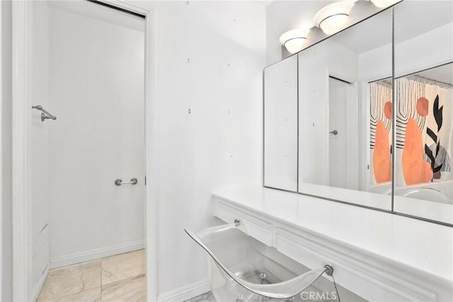 749 Canyon Crest Dr, Sierra Madre, CA 91024 - bathroom featuring marble finish flooring and baseboards