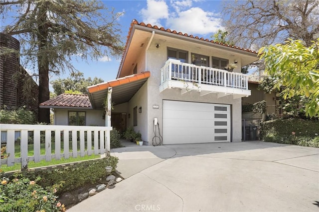 749 Canyon Crest Dr, Sierra Madre, CA 91024 - mediterranean / spanish home with a tile roof, a balcony, stucco siding, and driveway