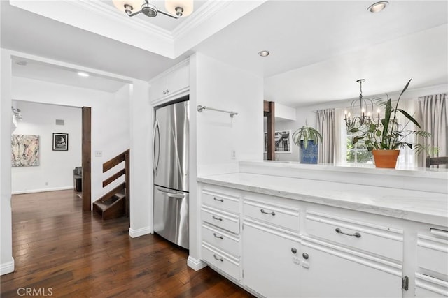 749 Canyon Crest Dr, Sierra Madre, CA 91024 - kitchen with a chandelier, stainless steel refrigerator, crown molding, dark wood finished floors, and light stone counters