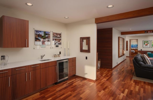 7226 Romero Dr, La Jolla, CA 92037 - indoor wet bar with beverage cooler, wood finished floors, recessed lighting, and baseboards