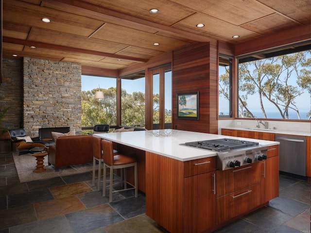 7226 Romero Dr, La Jolla, CA 92037 - view of patio / terrace featuring a stone fireplace and an outdoor kitchen