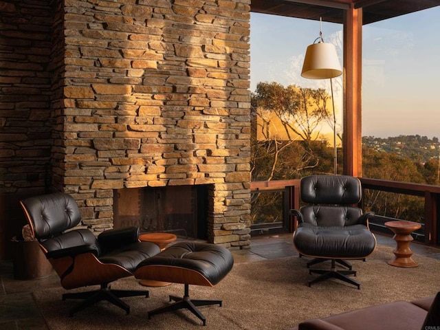 7226 Romero Dr, La Jolla, CA 92037 - living area with an outdoor stone fireplace and a wall of windows