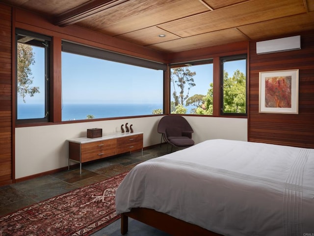 7226 Romero Dr, La Jolla, CA 92037 - bedroom with stone tile flooring, wooden ceiling, wooden walls, and baseboards