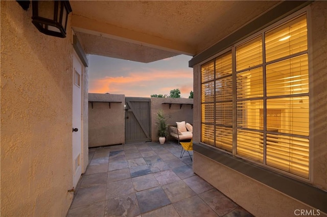 155 Oxford Unit 37, Irvine, CA 92612 - patio terrace at dusk with a gate