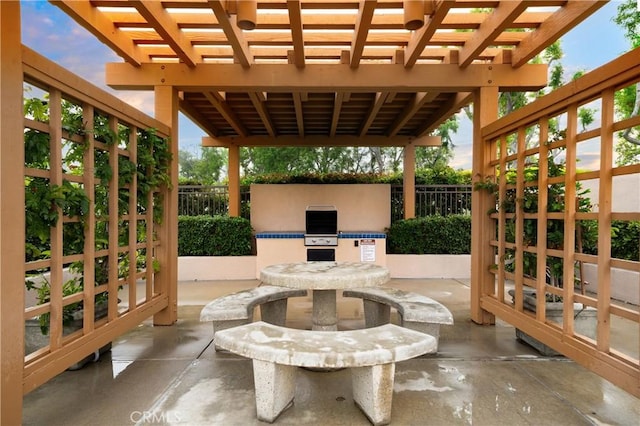 155 Oxford Unit 37, Irvine, CA 92612 - view of patio with exterior kitchen and a pergola
