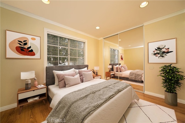 155 Oxford Unit 37, Irvine, CA 92612 - bedroom featuring wood finished floors, baseboards, ornamental molding, and recessed lighting