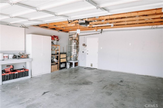 134 N American St, Ridgecrest, CA 93555 - garage featuring secured water heater and a garage door opener