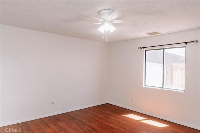 134 N American St, Ridgecrest, CA 93555 - unfurnished room featuring wood finished floors, baseboards, ceiling fan, and a textured ceiling