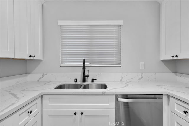 4622 San Jose St Unit W, Montclair, CA 91763 - kitchen featuring stainless steel dishwasher, a sink, white cabinets, and light stone countertops