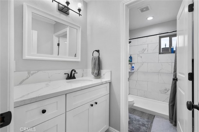 4622 San Jose St Unit W, Montclair, CA 91763 - bathroom with vanity, toilet, and a shower stall