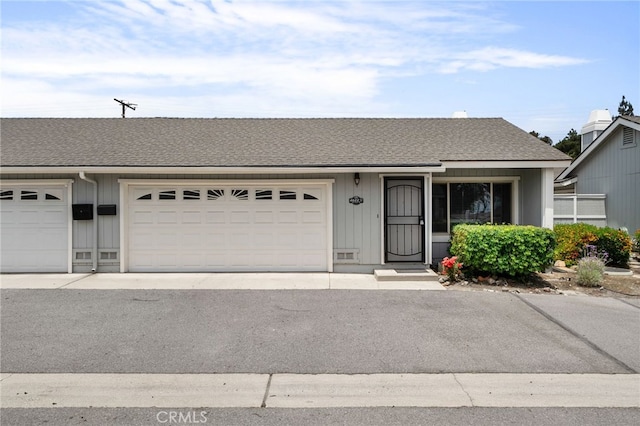 4622 San Jose St Unit W, Montclair, CA 91763 - view of front of property featuring roof with shingles and an attached garage