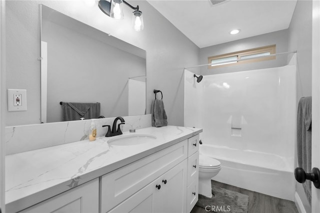 4622 San Jose St Unit W, Montclair, CA 91763 - bathroom with vanity, toilet,  shower combination, and wood finished floors