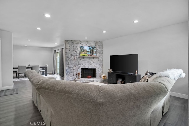 4622 San Jose St Unit W, Montclair, CA 91763 - living area with baseboards, dark wood-style floors, recessed lighting, and a stone fireplace