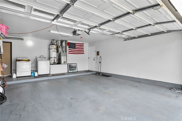 4622 San Jose St Unit W, Montclair, CA 91763 - garage with washing machine and dryer, strapped water heater, and a garage door opener