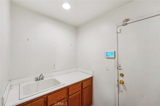 16443 Pine Forest St, Fontana, CA 92336 - laundry area featuring a sink