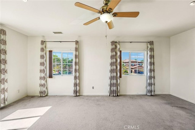 16443 Pine Forest St, Fontana, CA 92336 - empty room featuring healthy amount of natural light, carpet flooring, ceiling fan, and baseboards
