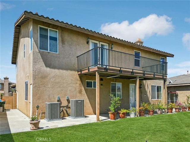 16443 Pine Forest St, Fontana, CA 92336 - rear view of house with cooling unit, stucco siding, and a lawn