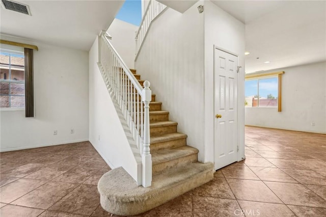 16443 Pine Forest St, Fontana, CA 92336 - staircase featuring plenty of natural light and recessed lighting
