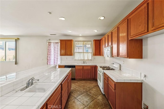 16443 Pine Forest St, Fontana, CA 92336 - kitchen featuring white appliances, tile countertops, a sink, and recessed lighting