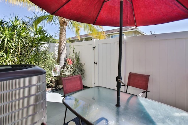4502 Bates Dr, Yorba Linda, CA 92886 - view of patio / terrace featuring central air condition unit, outdoor dining space, and a gate