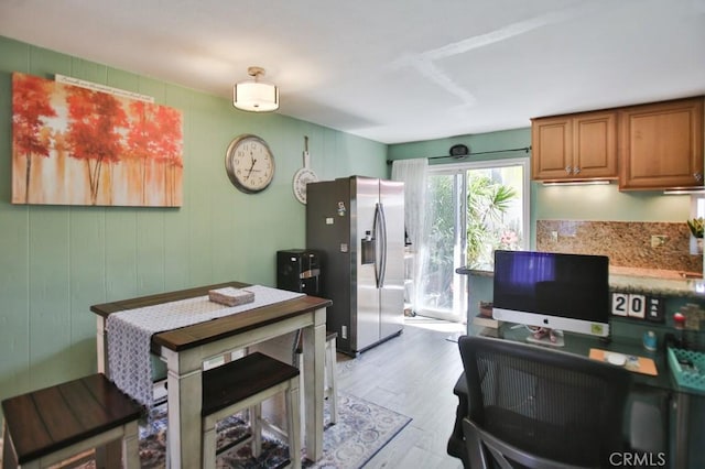 4502 Bates Dr, Yorba Linda, CA 92886 - kitchen with stainless steel fridge with ice dispenser, light wood finished floors, and brown cabinetry