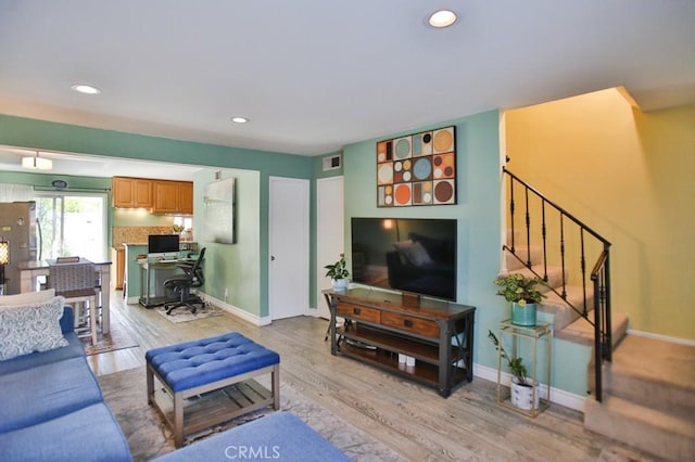 4502 Bates Dr, Yorba Linda, CA 92886 - living room with light wood-type flooring, recessed lighting, baseboards, and stairs