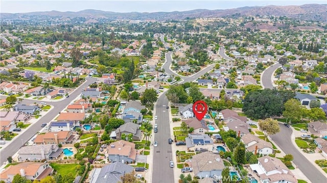 5940 Avenida Antigua, Yorba Linda, CA 92887 - aerial overview of property's location with a mountain backdrop and nearby suburban area