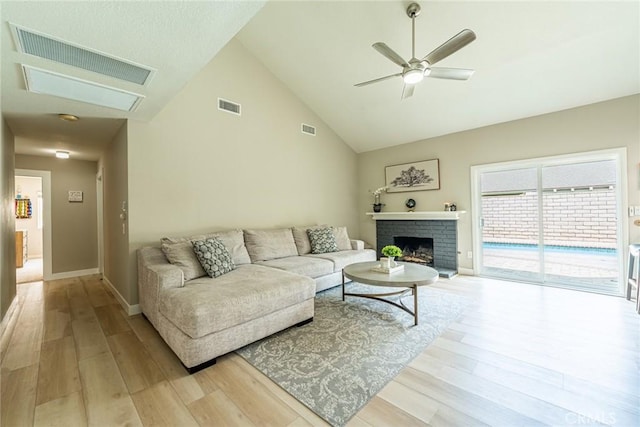 5940 Avenida Antigua, Yorba Linda, CA 92887 - living room featuring light wood finished floors, a ceiling fan, a fireplace, high vaulted ceiling, and baseboards