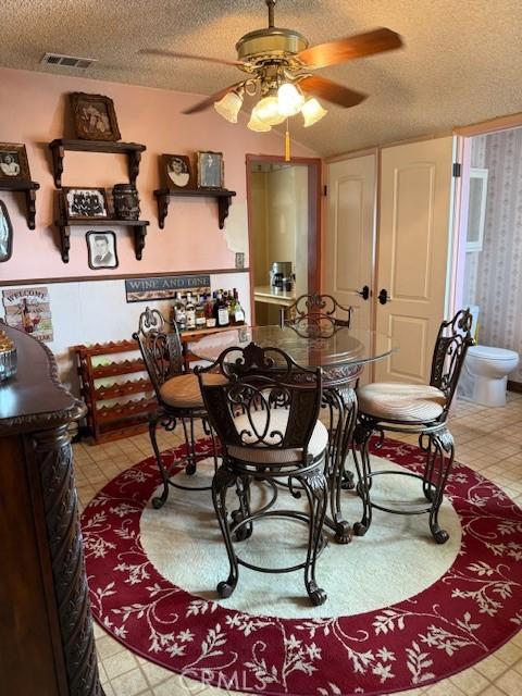 9912 Muroc St, Bellflower, CA 90706 - dining space featuring a textured ceiling and a ceiling fan