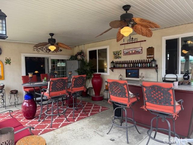 9912 Muroc St, Bellflower, CA 90706 - view of patio / terrace with a ceiling fan and an outdoor bar