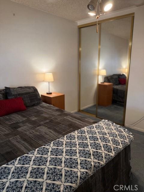 9912 Muroc St, Bellflower, CA 90706 - carpeted bedroom featuring a closet and a textured ceiling