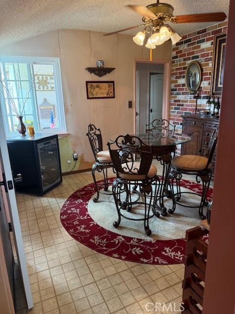 9912 Muroc St, Bellflower, CA 90706 - dining area featuring a textured ceiling, ceiling fan, and lofted ceiling