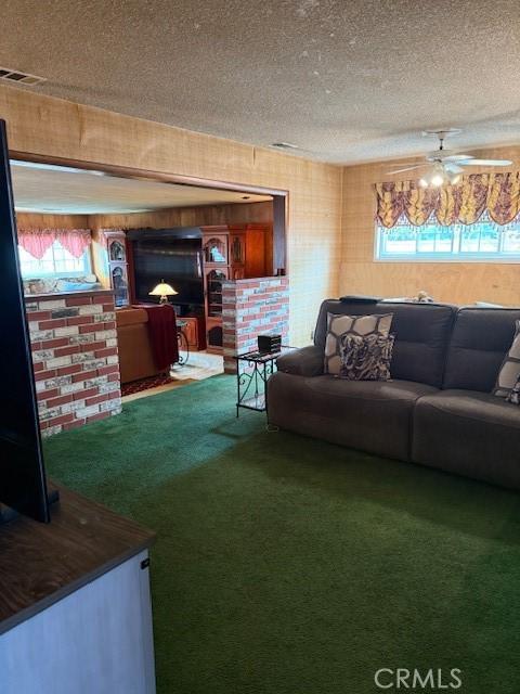 9912 Muroc St, Bellflower, CA 90706 - living area featuring a textured ceiling, carpet flooring, and plenty of natural light