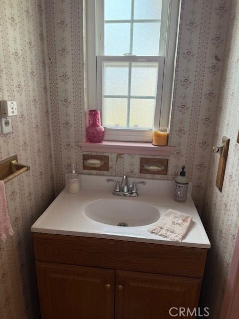 9912 Muroc St, Bellflower, CA 90706 - bathroom with wallpapered walls and vanity