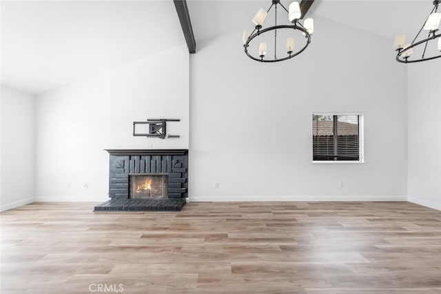 5453 Softwind Way, Agoura Hills, CA 91301 - unfurnished living room with a chandelier, high vaulted ceiling, baseboards, wood finished floors, and beamed ceiling
