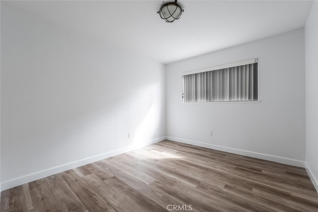 5453 Softwind Way, Agoura Hills, CA 91301 - empty room with wood finished floors and baseboards