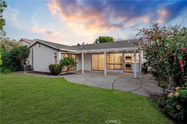 5453 Softwind Way, Agoura Hills, CA 91301 - rear view of property featuring a patio, central AC unit, stucco siding, a lawn, and a pergola