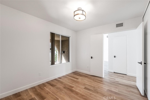 5453 Softwind Way, Agoura Hills, CA 91301 - unfurnished bedroom with light wood finished floors and baseboards